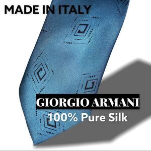 Used teal men’s silk Armani tie.